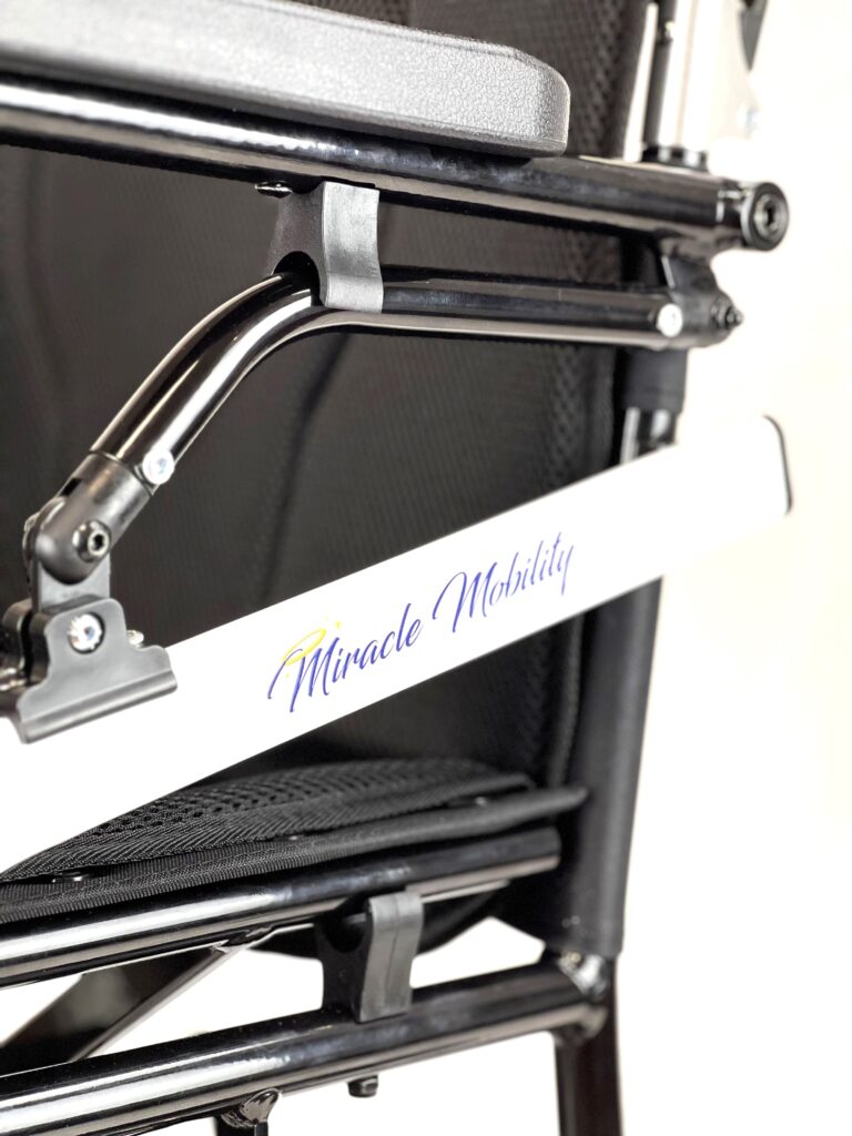 A black chair with a white sign on it