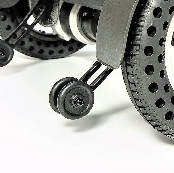 A close up of the wheels on a wheelchair