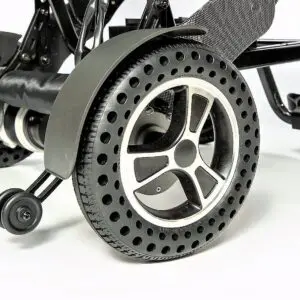 A close up of the wheel on a black and silver scooter