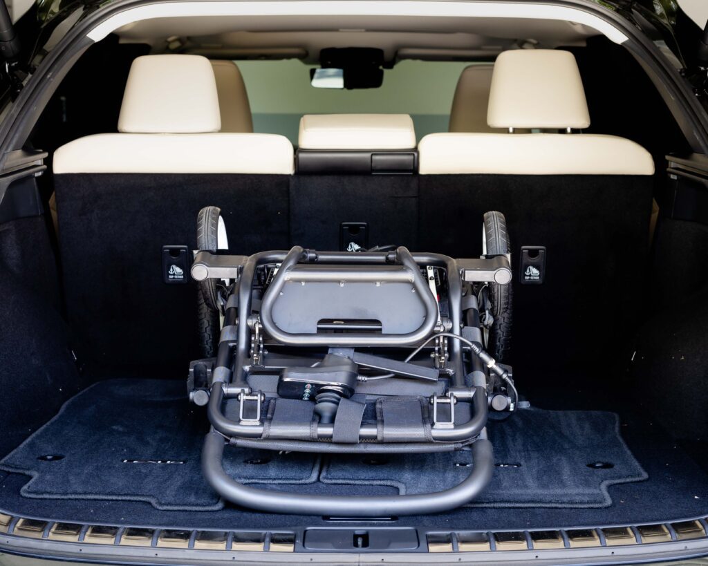 Folded wheelchair in car trunk